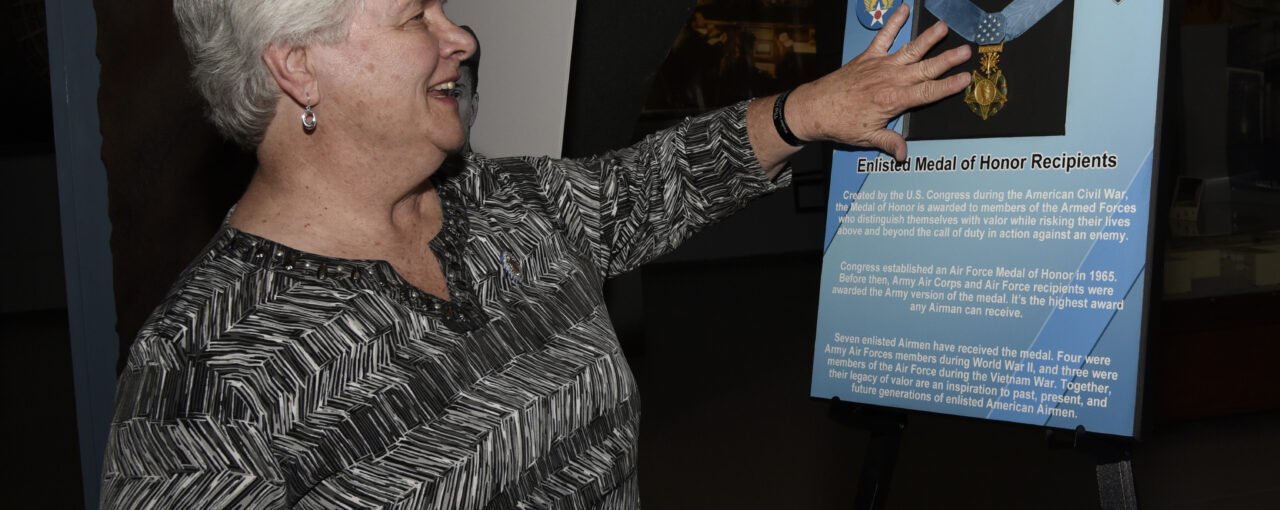 PETERSON AIR FORCE BASE, Colo. – Terry Chapman, mother of Master Sgt. John Chapman, touches the Medal of Honor after a ceremony at the Peterson Air and Space Museum, May 20, 2019. She had never touched her son’s official Medal of Honor, as the medal was given to Chapman’s wife. She received the Medal of Honor flag. (U.S. Air Force photo by Staff Sgt. Alexandra M. Longfellow)