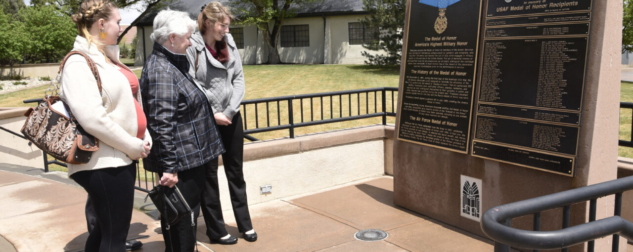 PETERSON AIR FORCE BASE, Colo. – Terry Chapman, mother of Master Sgt. John Chapman, and family members look at his name etched upon the Medal of Honor memorial May 20, 2019 at the Peterson Air and Space Museum. Sergeant Chapman’s name is memorialized along with 62 of his fellow heroic Airmen, for all who live, work or visit Peterson AFB to see. (U.S. Air Force photo by Staff Sgt. Alexandra M. Longfellow)
