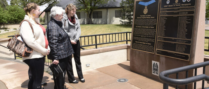 PETERSON AIR FORCE BASE, Colo. – Terry Chapman, mother of Master Sgt. John Chapman, and family members look at his name etched upon the Medal of Honor memorial May 20, 2019 at the Peterson Air and Space Museum. Sergeant Chapman’s name is memorialized along with 62 of his fellow heroic Airmen, for all who live, work or visit Peterson AFB to see. (U.S. Air Force photo by Staff Sgt. Alexandra M. Longfellow)